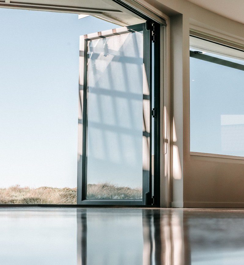 A large open window with a view of the sky.