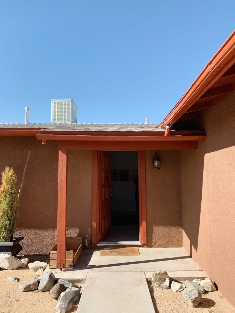 A house with a roof that has been painted red.